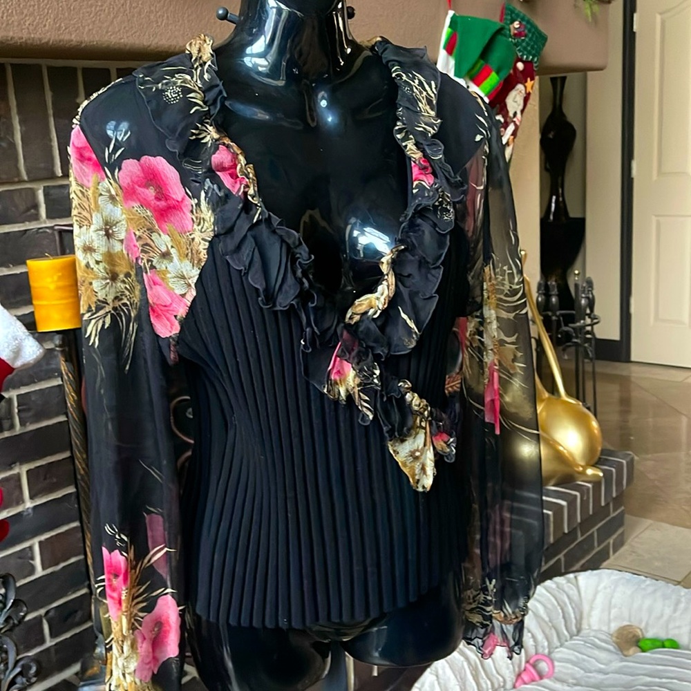 Black ribbed top with sheer floral sleeve. 100% silk with rayon/spandex